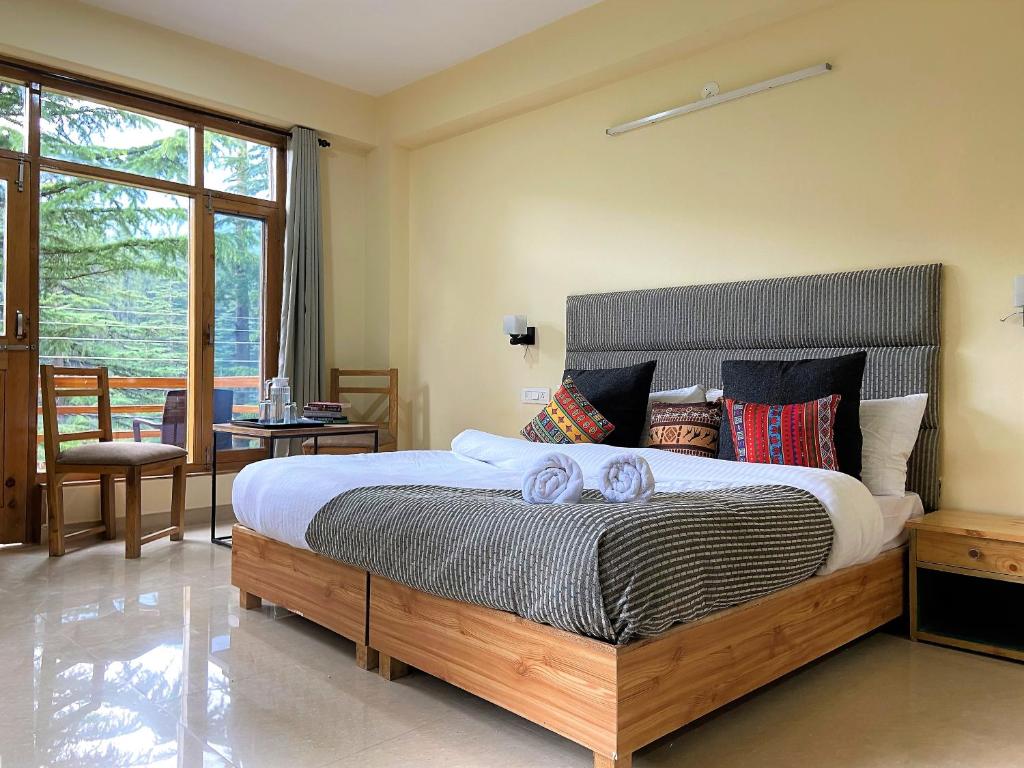 Postel nebo postele na pokoji v ubytování Getaway Stays Manali