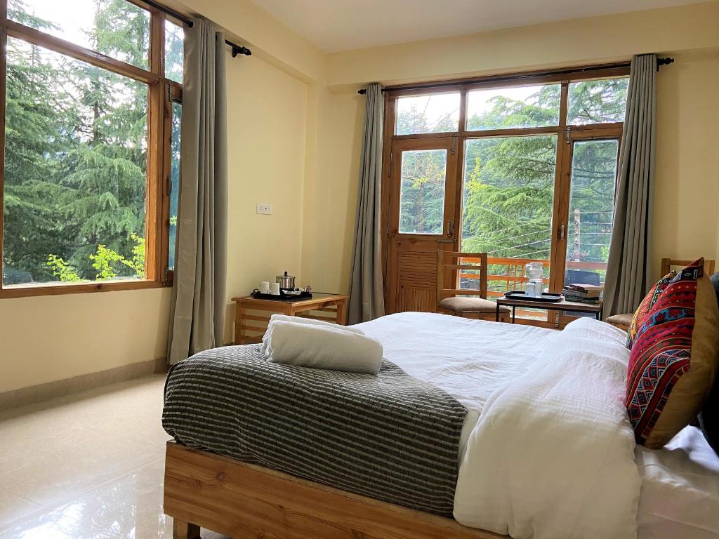 Postel nebo postele na pokoji v ubytování Getaway Stays Manali