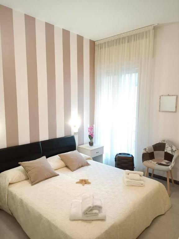 Postel nebo postele na pokoji v ubytování Hotel Cristoforo Colombo