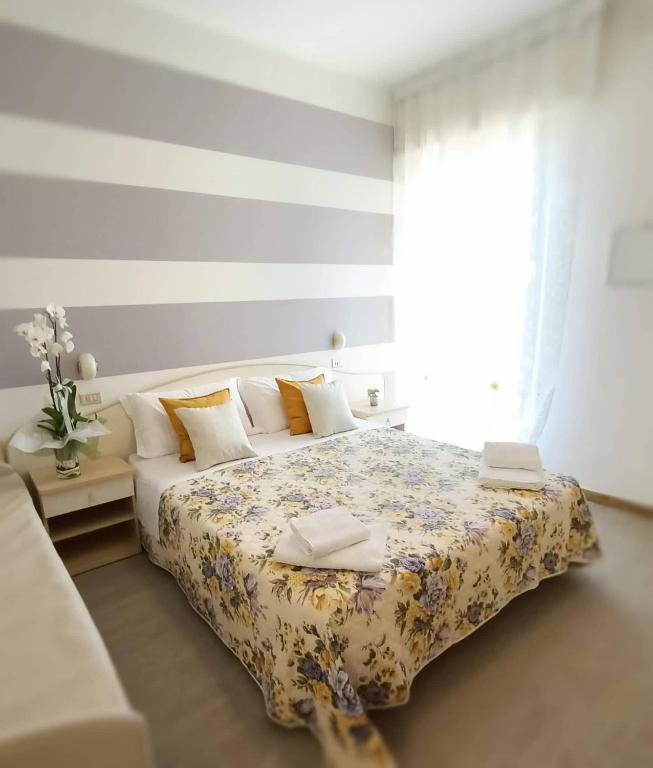 Postel nebo postele na pokoji v ubytování Hotel Cristoforo Colombo