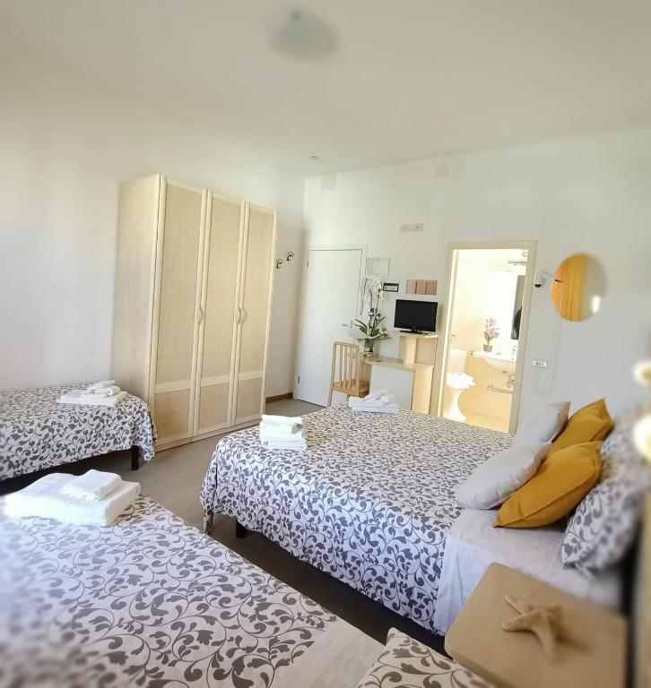 Postel nebo postele na pokoji v ubytování Hotel Cristoforo Colombo