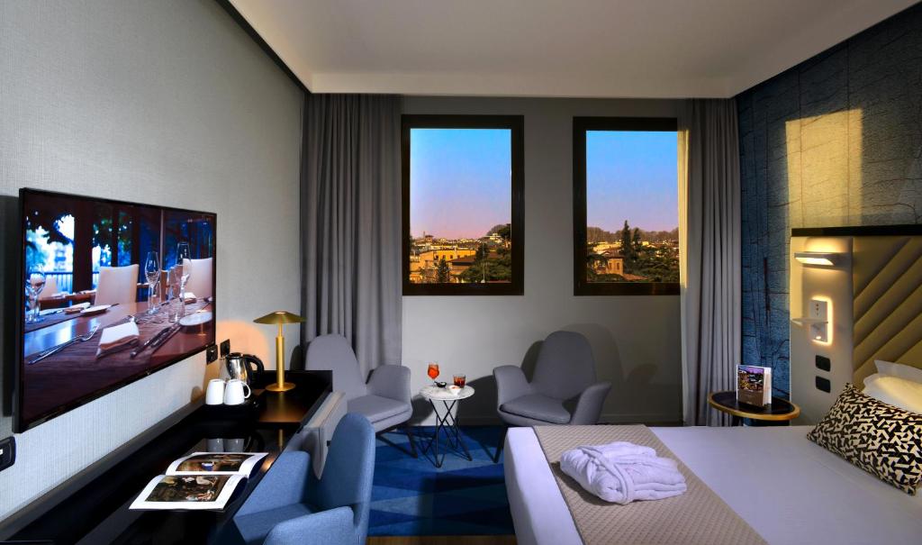 TV a/nebo společenská místnost v ubytování Savhotel Aemilia Bologna