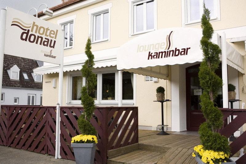 a hotel doorway with a sign in front of a building at Hotel Donau in Donauwörth