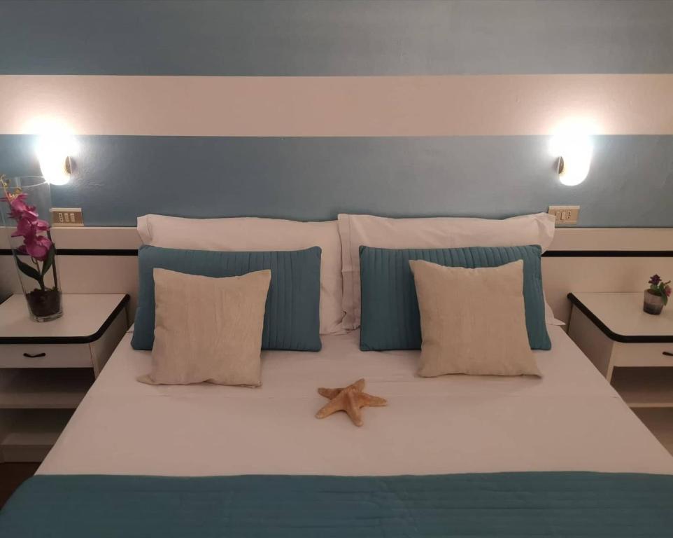 Postel nebo postele na pokoji v ubytování Hotel Cristoforo Colombo
