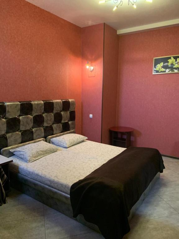 Postel nebo postele na pokoji v ubytování Na Bukovinskoy Guest House