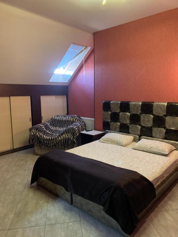 Postel nebo postele na pokoji v ubytování Na Bukovinskoy Guest House