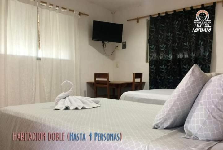 Postel nebo postele na pokoji v ubytování Hotel Miriam Bacalar