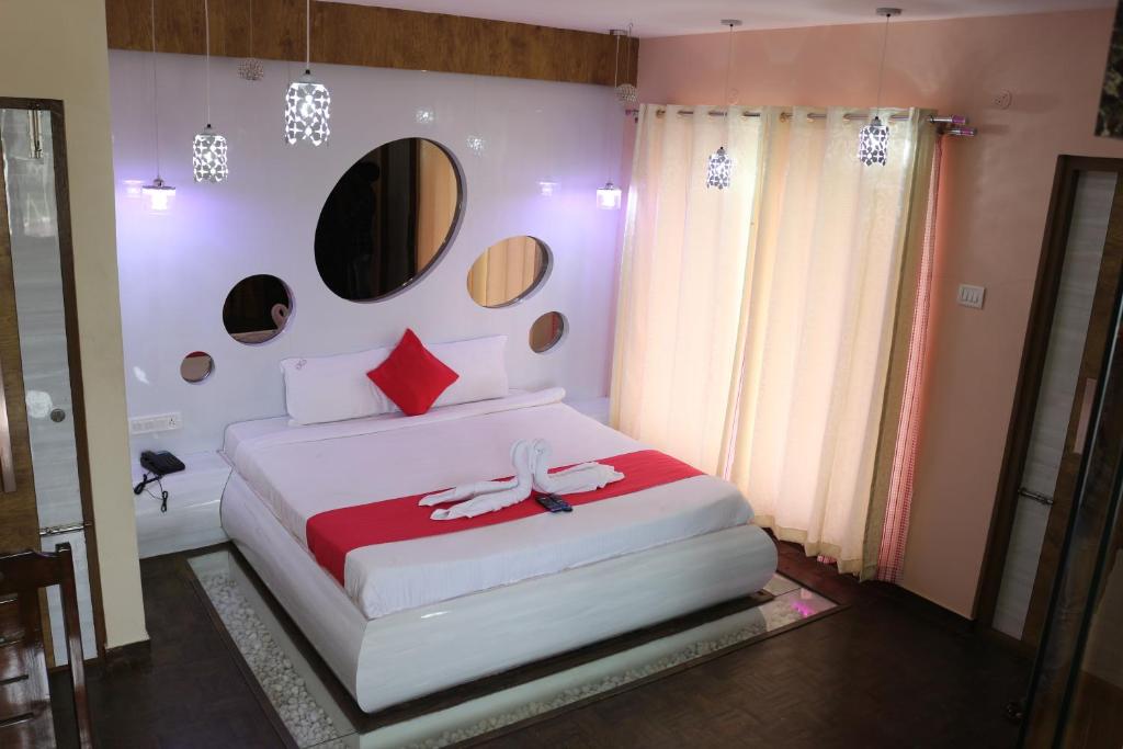 Krevet ili kreveti u jedinici u objektu Kasa Luxury Inn
