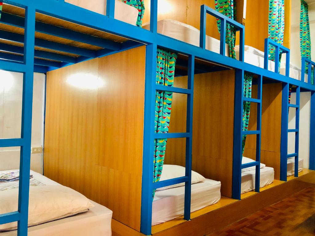 Postel nebo postele na pokoji v ubytování DoDoWu Homestay