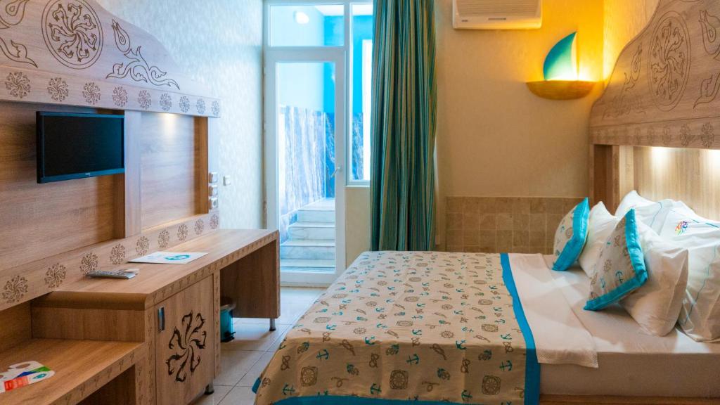 Postel nebo postele na pokoji v ubytování Miarosa Kemer Beach