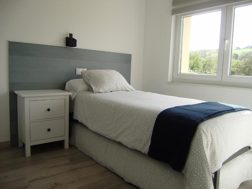Postel nebo postele na pokoji v ubytování Apartamentos La Tata