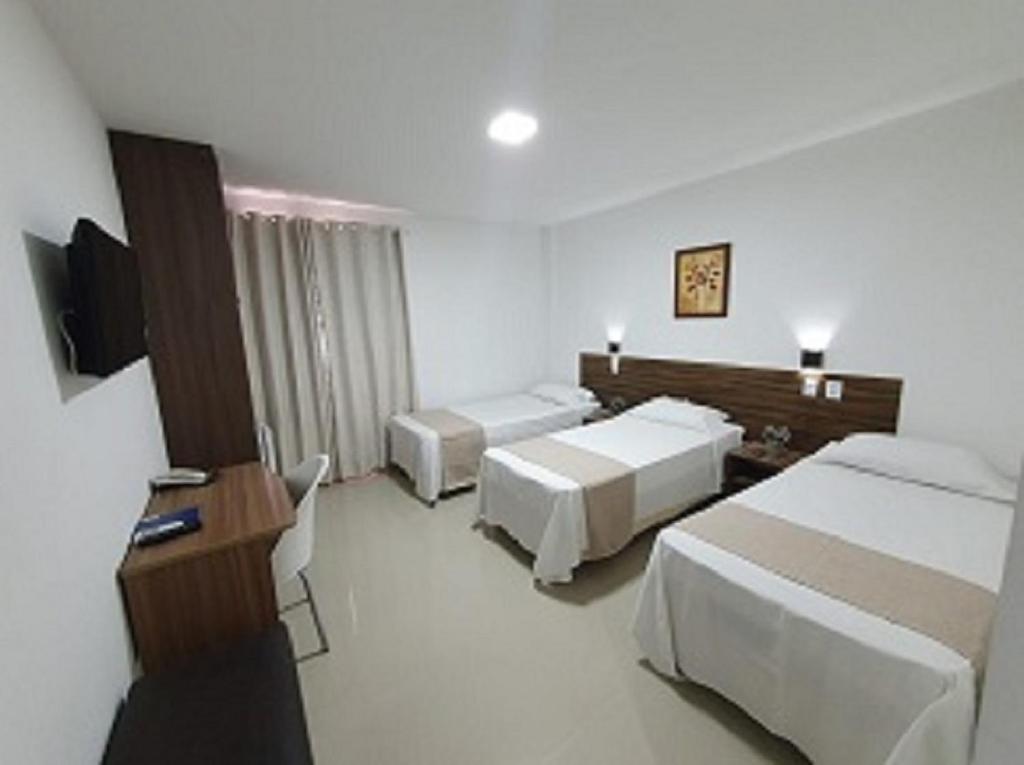 Кровать или кровати в номере Hotel Bellavista