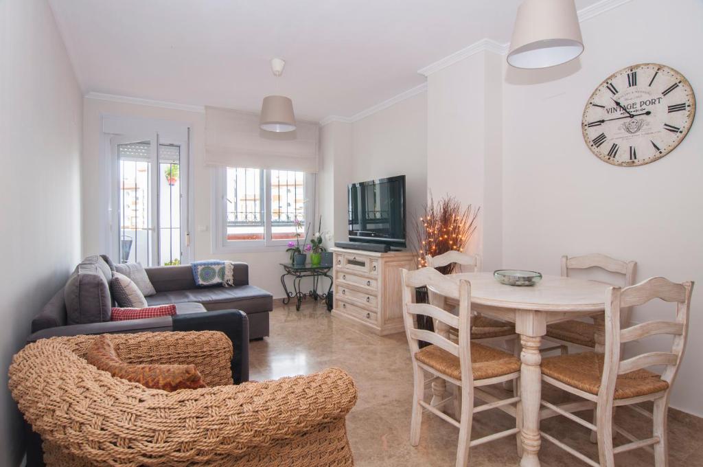A television and/or entertainment centre at Sea view apartment, shared pools, Estepona, 60 m²