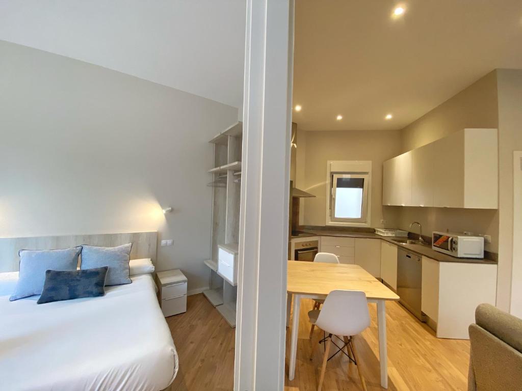 Posteľ alebo postele v izbe v ubytovaní Apartamentos MIRADOR DEL TRANSITO