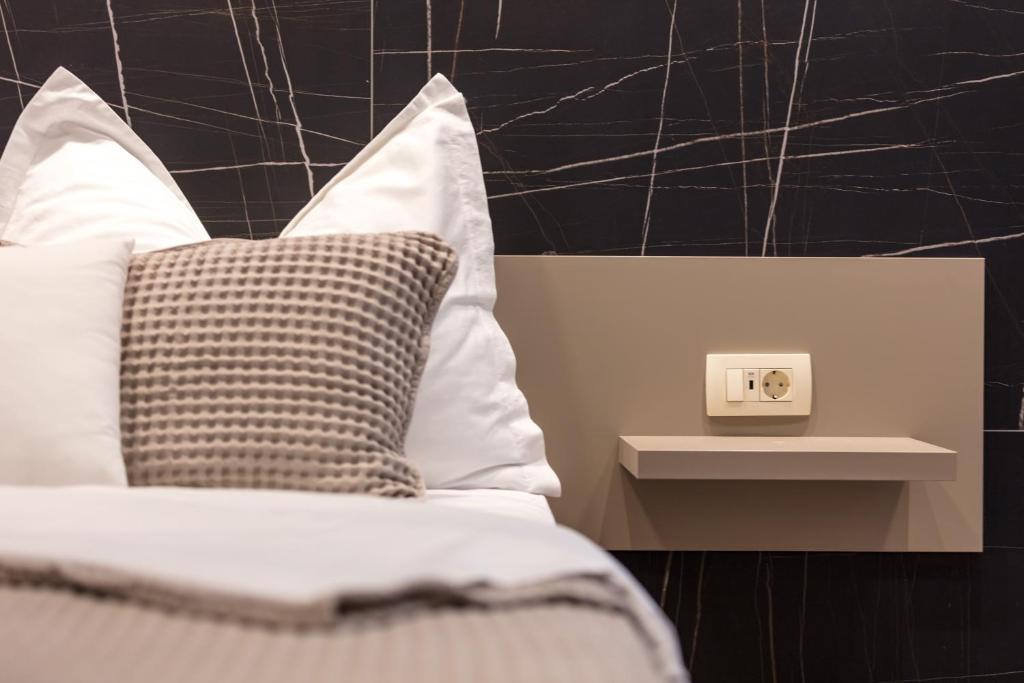 Postel nebo postele na pokoji v ubytování Aborda Rooms