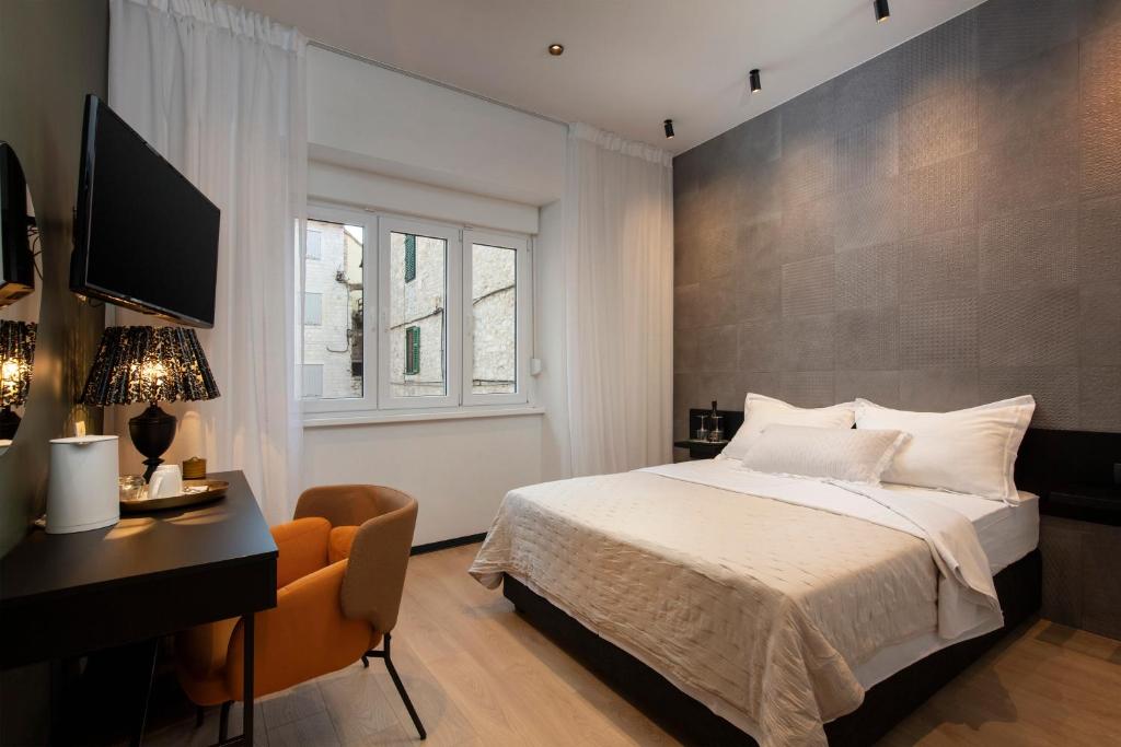 Postel nebo postele na pokoji v ubytování Aborda Rooms
