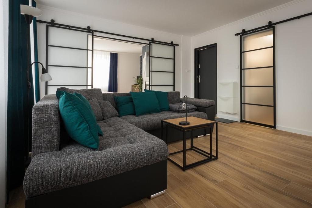 a living room with a couch and a table at ApartsW241 in Jelenia Góra