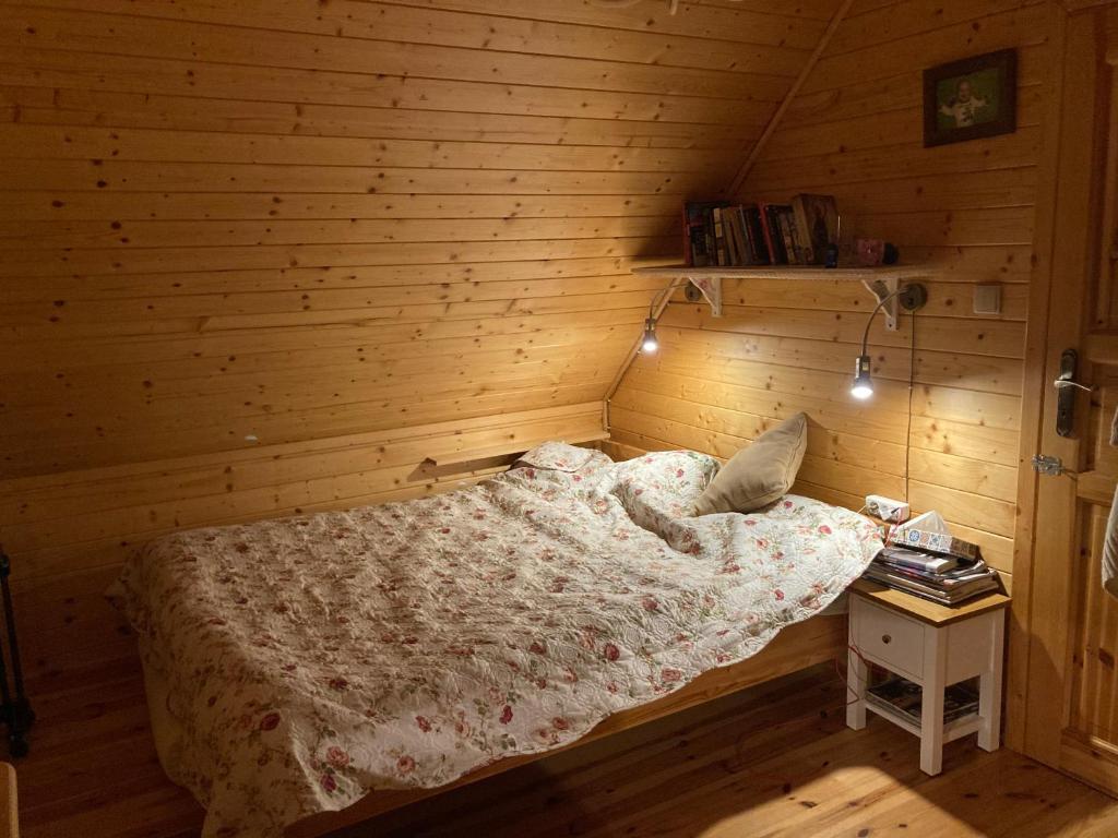 Postel nebo postele na pokoji v ubytování Zielony Domek z jacuzzi
