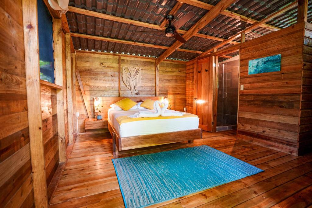 Ένα ή περισσότερα κρεβάτια σε δωμάτιο στο Palmar Beach Lodge
