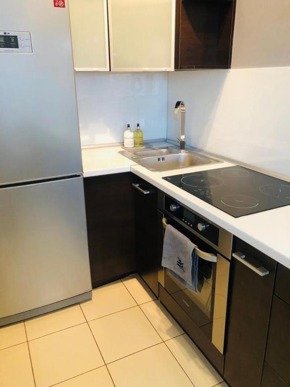Kuchyňa alebo kuchynka v ubytovaní Łuczański Apartament w sercu Giżycka