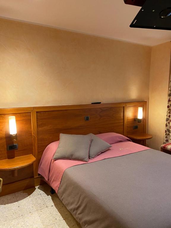 Postel nebo postele na pokoji v ubytování Hostal Montaña