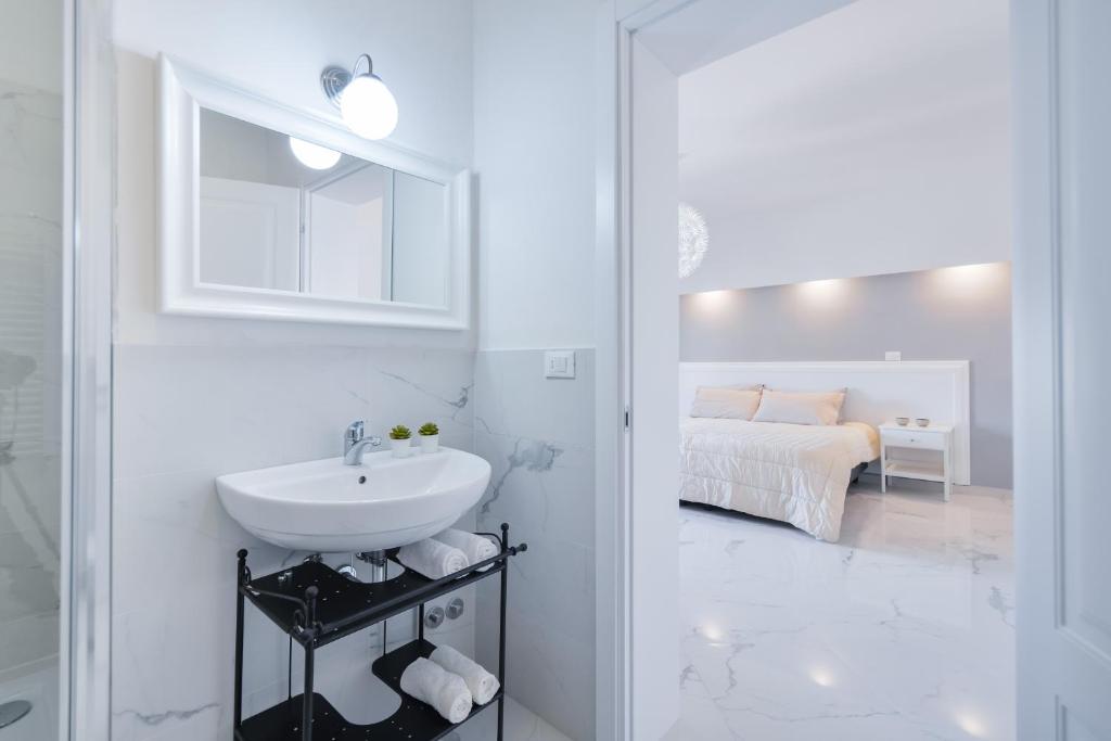 Posteľ alebo postele v izbe v ubytovaní New Central Apartment