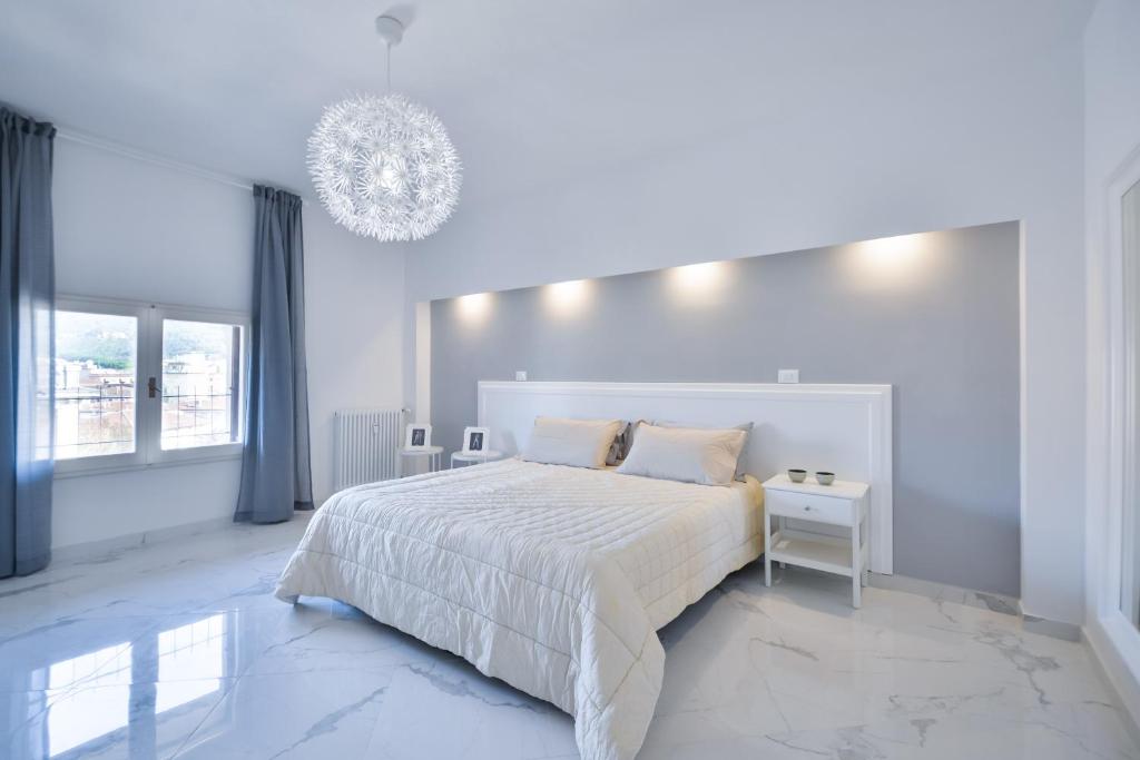 Posteľ alebo postele v izbe v ubytovaní New Central Apartment