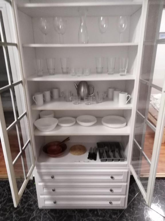 Kuchyň nebo kuchyňský kout v ubytování Arinza Apartman Vendégház