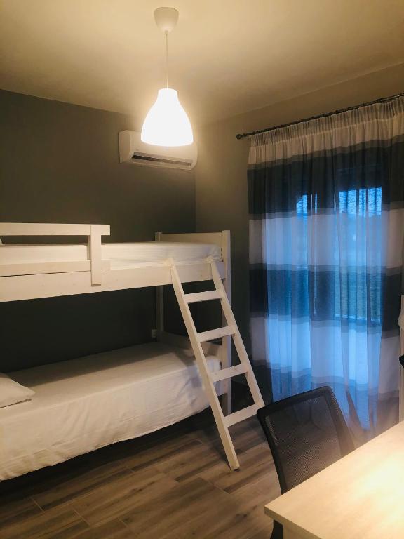 Postel nebo postele na pokoji v ubytování Villa Marietta
