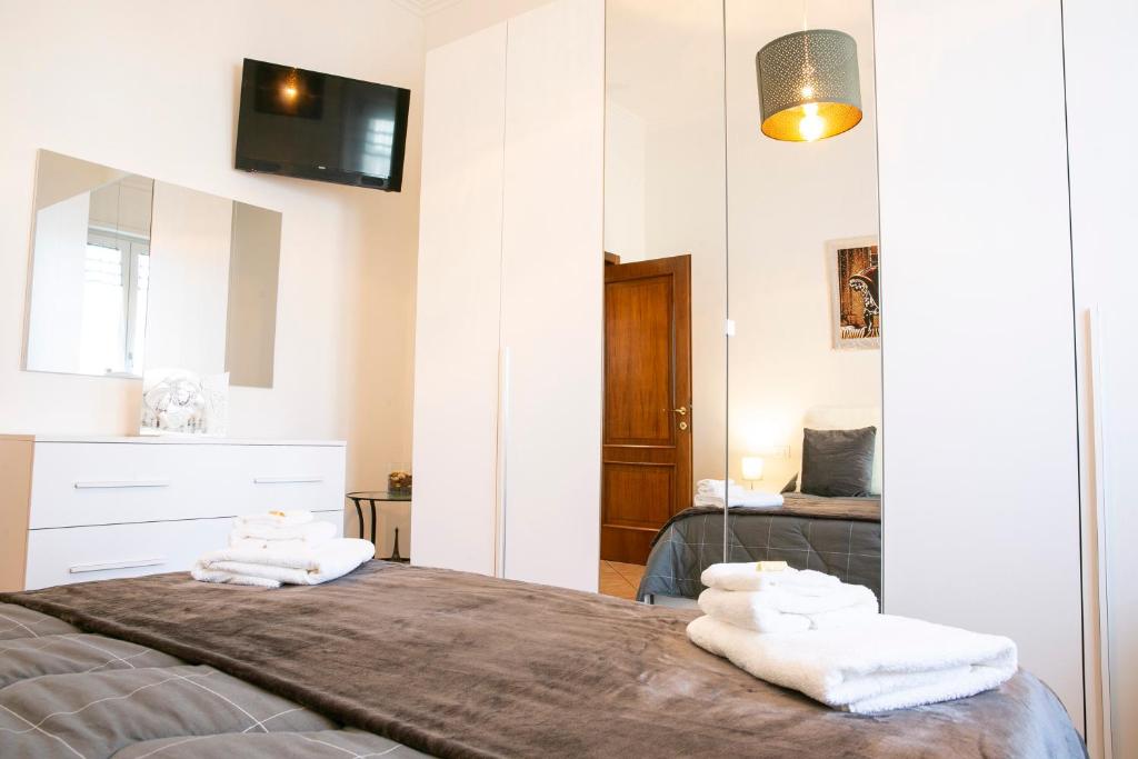 Łóżko lub łóżka w pokoju w obiekcie Gioviale House Pescara