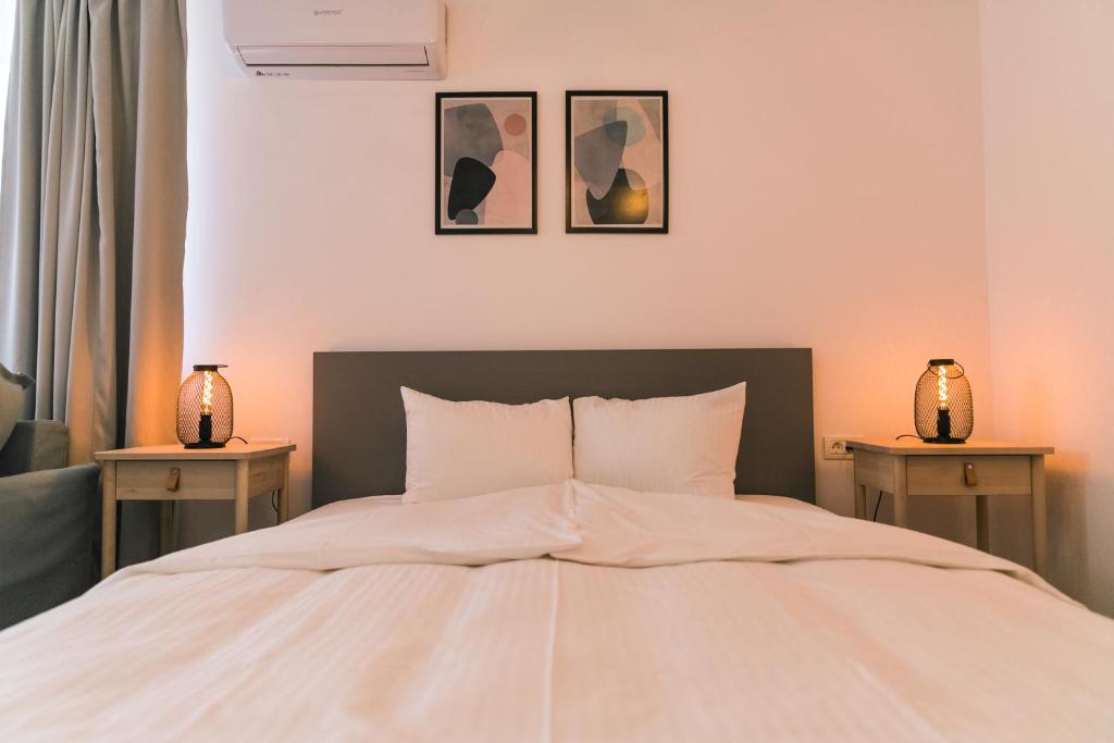 Postel nebo postele na pokoji v ubytování NORDIC Home