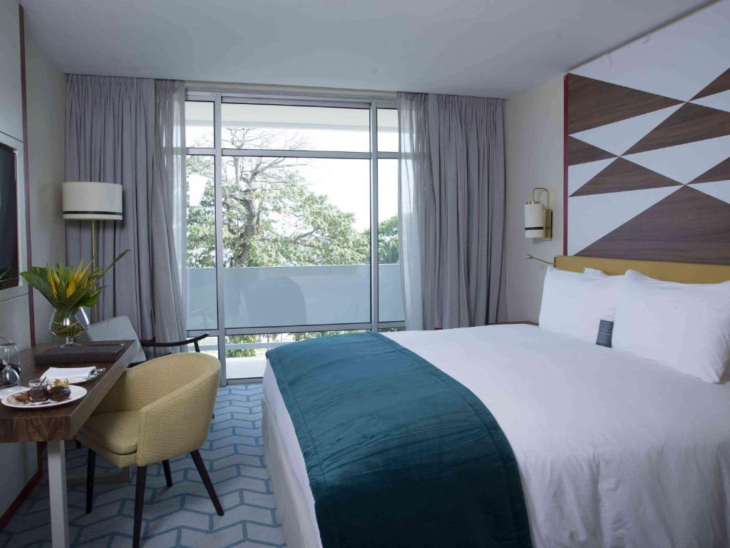 Un ou plusieurs lits dans un hébergement de l'établissement Sofitel Abidjan Hotel Ivoire