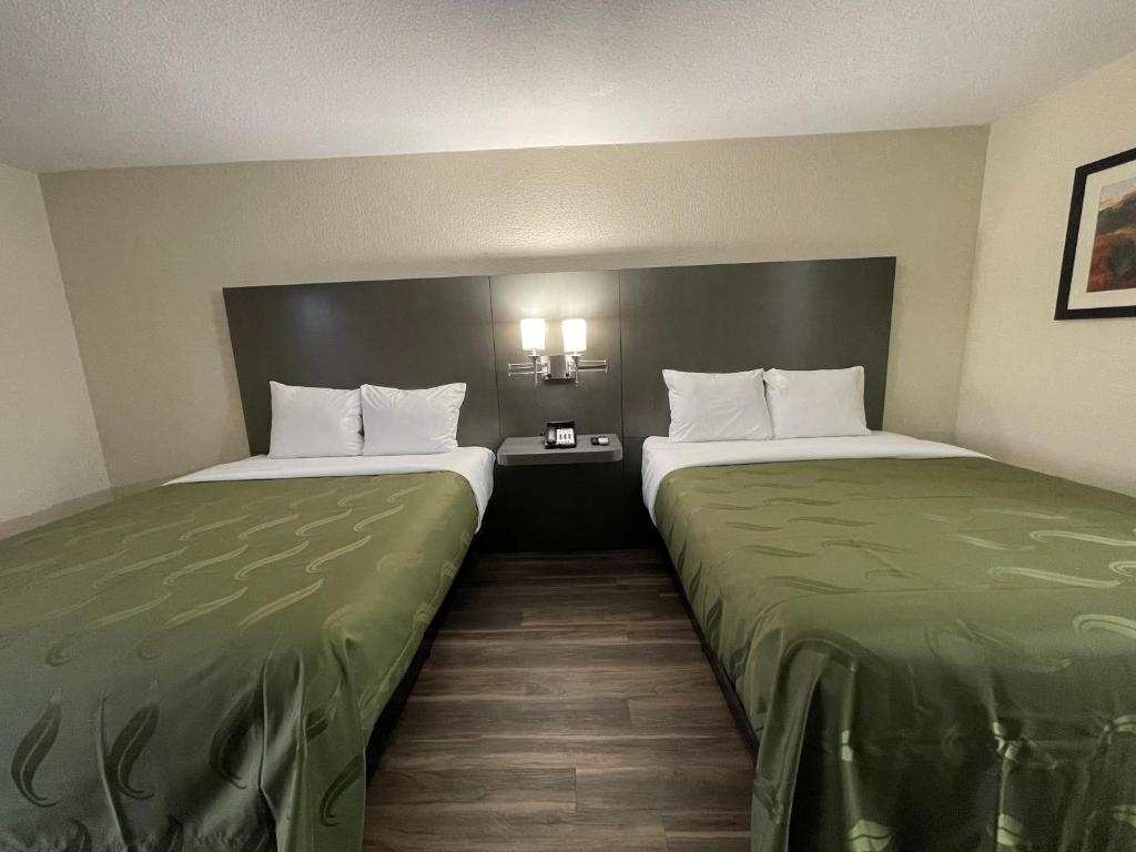 Postel nebo postele na pokoji v ubytování Dreamland Inn