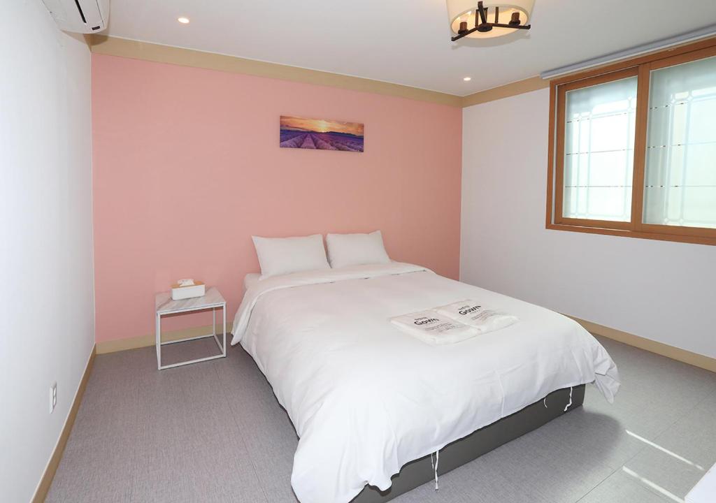 Postel nebo postele na pokoji v ubytování Maison Mini Hotel