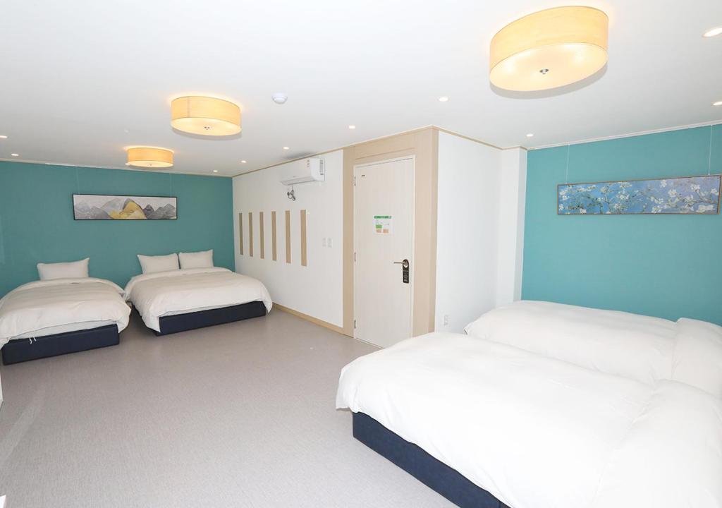Postel nebo postele na pokoji v ubytování Maison Mini Hotel