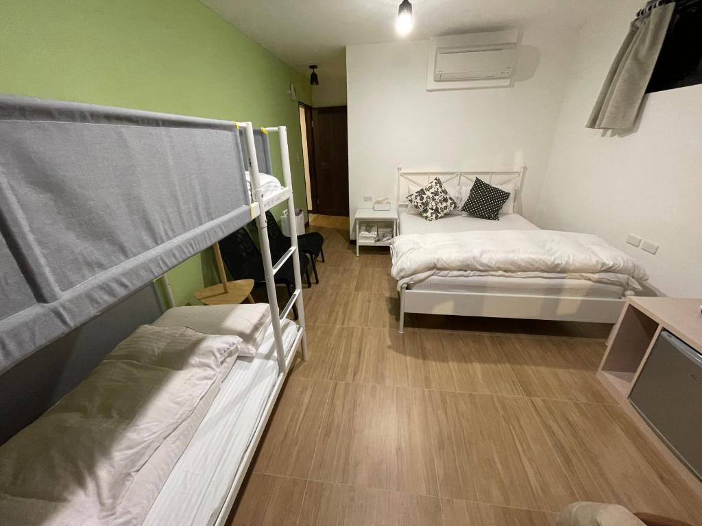 Postel nebo postele na pokoji v ubytování Lucky House B&B