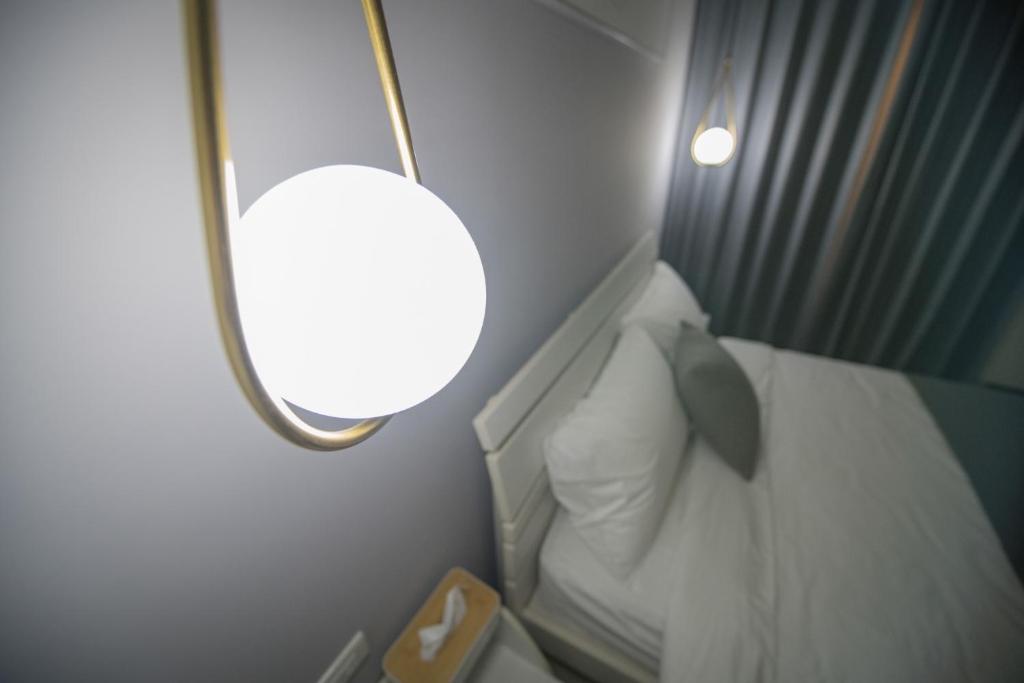 Postel nebo postele na pokoji v ubytování 漫時光 旅空間 ManLu INN