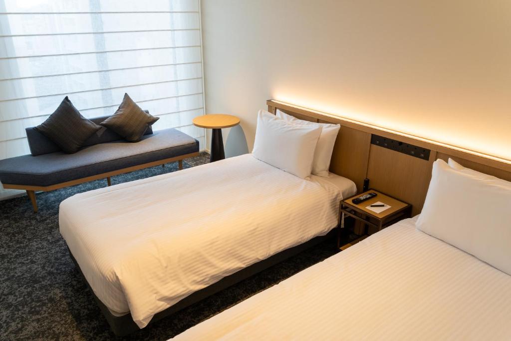 Postel nebo postele na pokoji v ubytování Park Hotel Kyoto