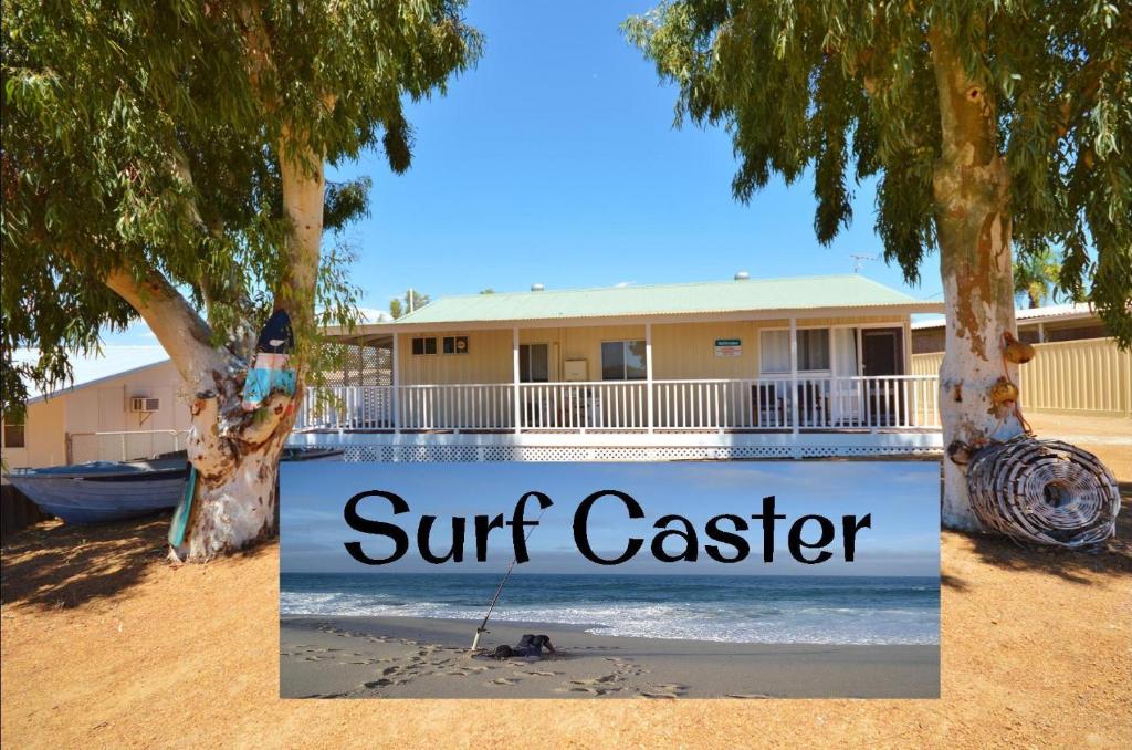 a sign that reads surf caster on a beach at Surf Caster - Kalbarri, WA in Kalbarri