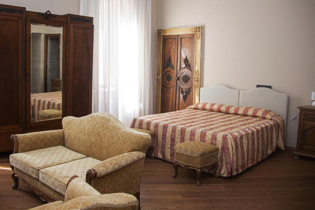 Postel nebo postele na pokoji v ubytování Hotel Tornielli 9 by LVG Hotel Collection