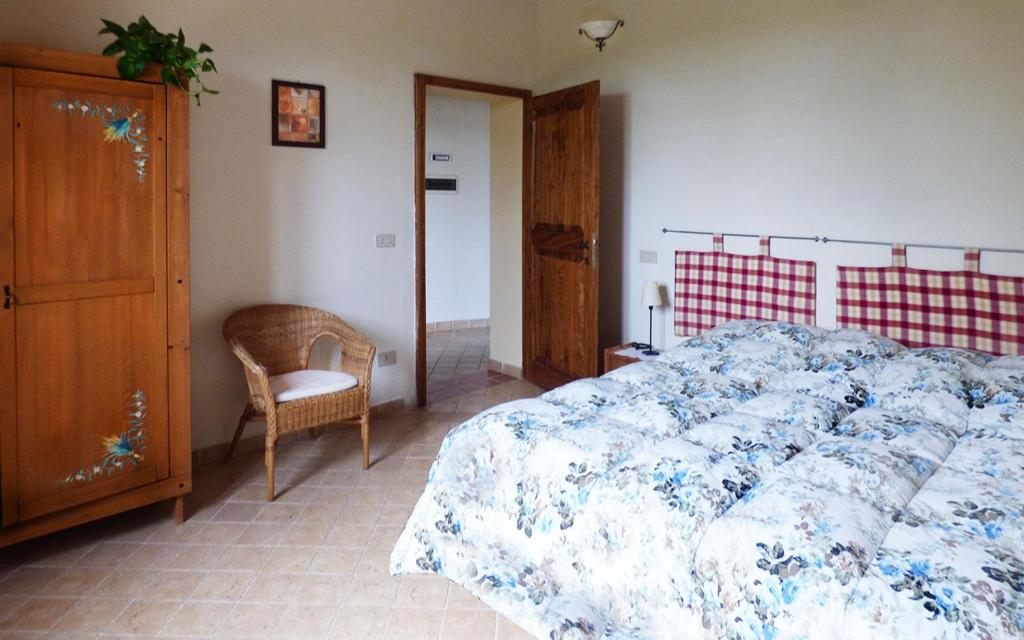 Łóżko lub łóżka w pokoju w obiekcie Agriturismo San Fabio