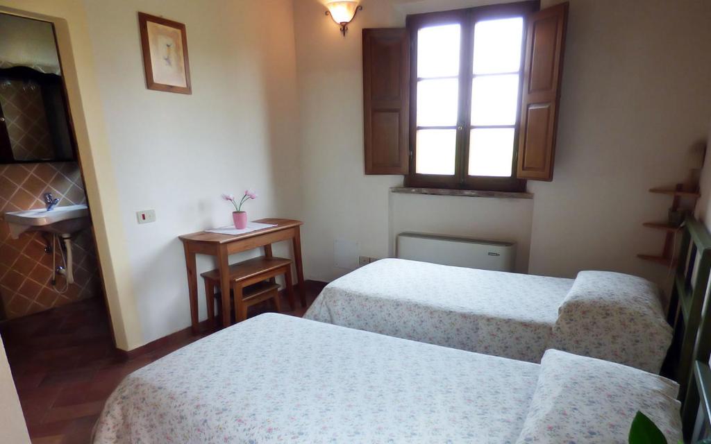 Łóżko lub łóżka w pokoju w obiekcie Agriturismo San Fabio