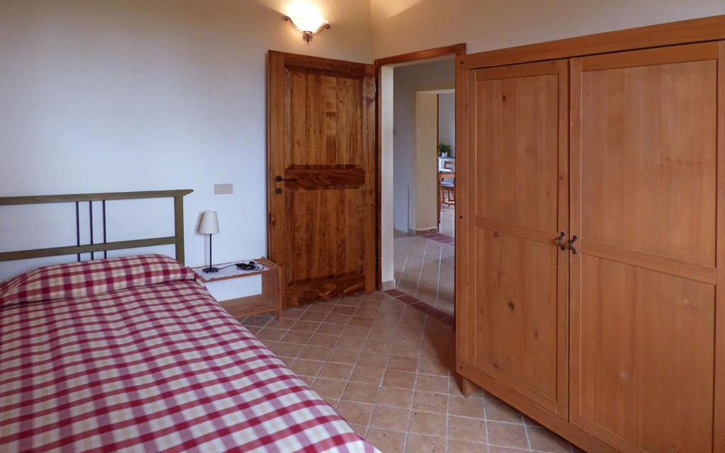 Łóżko lub łóżka w pokoju w obiekcie Agriturismo San Fabio