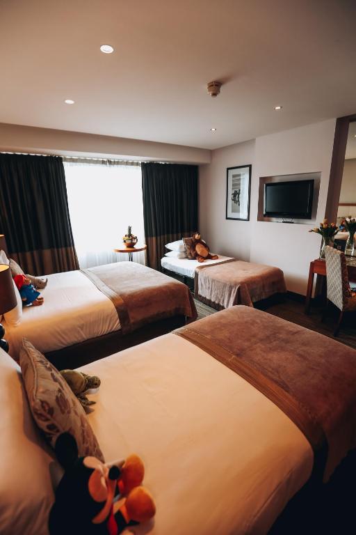 Postel nebo postele na pokoji v ubytování Rochestown Park Hotel & Leisure Centre