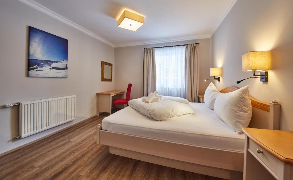 Posteľ alebo postele v izbe v ubytovaní Hüttl Relax Appartements