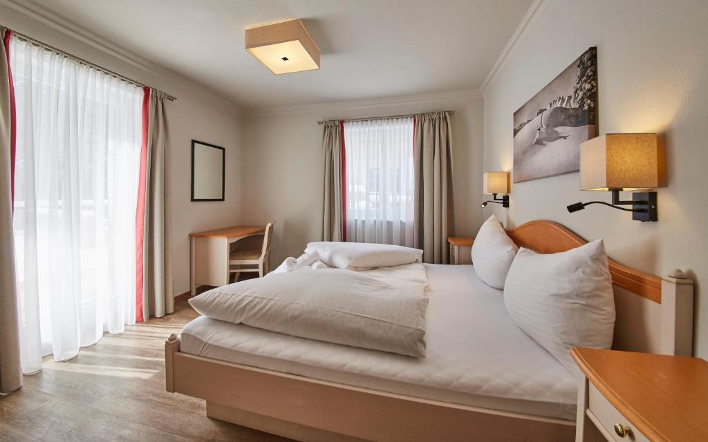 Posteľ alebo postele v izbe v ubytovaní Hüttl Relax Appartements