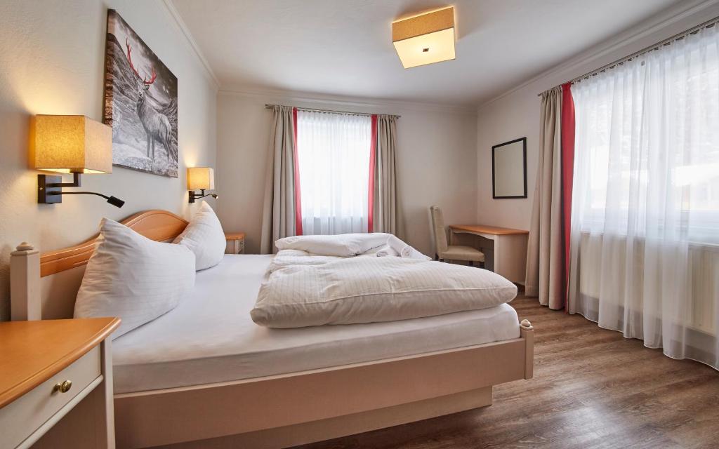 Posteľ alebo postele v izbe v ubytovaní Hüttl Relax Appartements