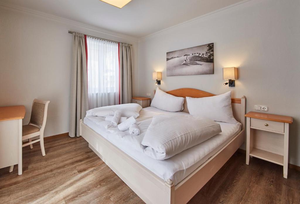 Posteľ alebo postele v izbe v ubytovaní Hüttl Relax Appartements