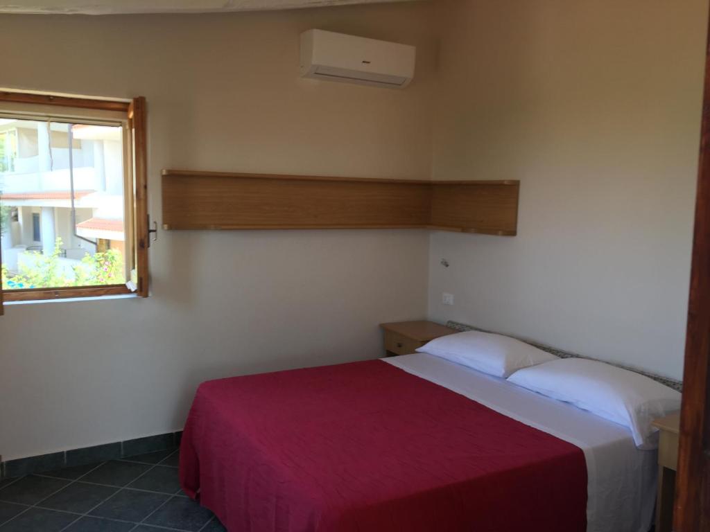 Łóżko lub łóżka w pokoju w obiekcie Tenuta Conte Ruggero