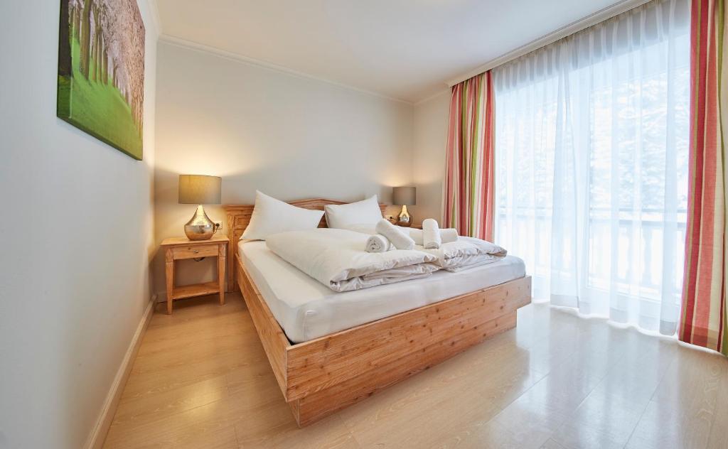 Posteľ alebo postele v izbe v ubytovaní Hüttl Relax Appartements
